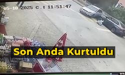 Aracın altında kalmaktan son anda kurtuldu