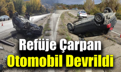 Takla atan otomobilden 2 kişi yaralı kurtuldu