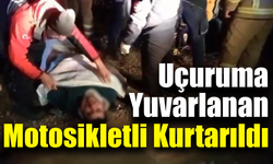 Uçuruma yuvarlanan motosikletliyi ekipler kurtardı