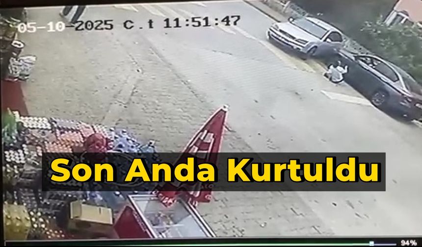 Aracın altında kalmaktan son anda kurtuldu